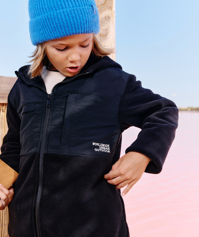  Child - boy's black fleece jacket with zipped pockets and message