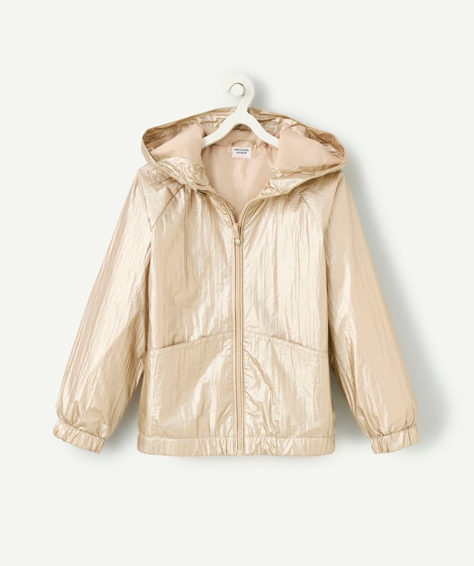   - Girl's gold windbreaker