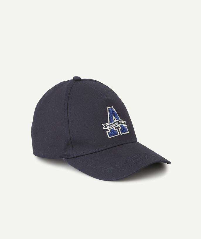   - navy blue boy's cap with embroidered message