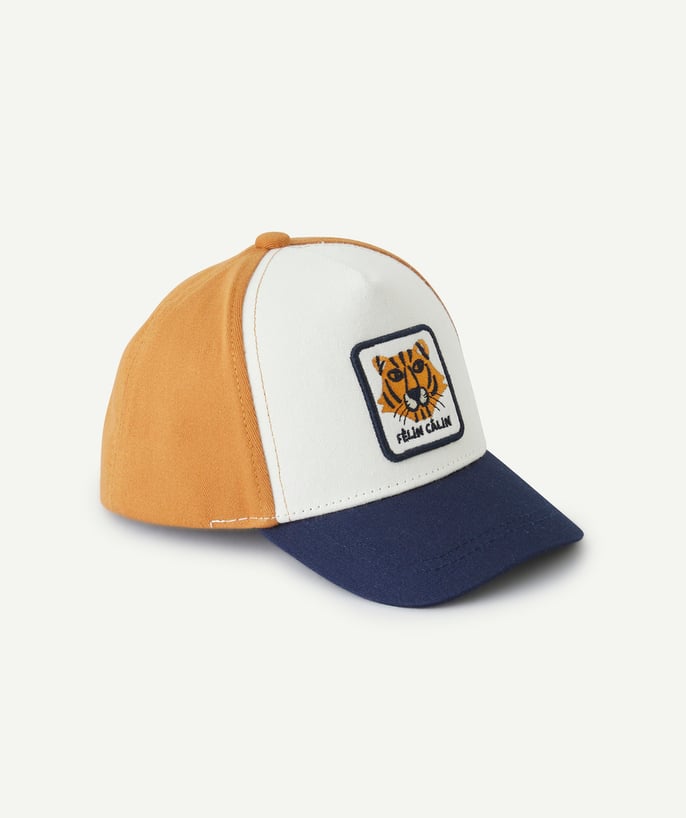   - baby boy white blue and camel cap with tiger patch