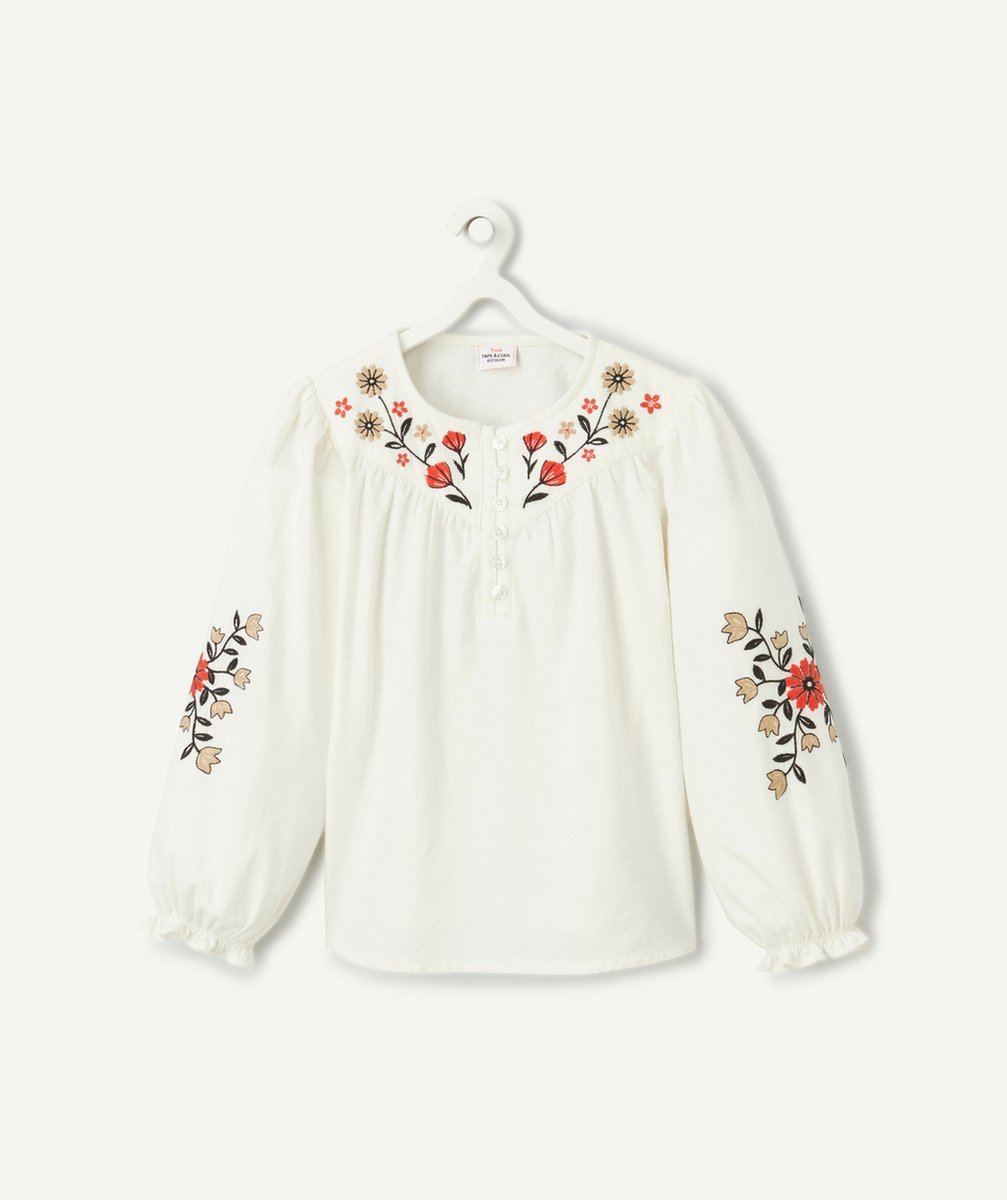   - white girl's blouse with floral details