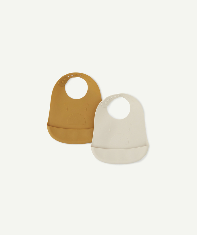   - SET OF TWO BEIGE AND OCHRE SILICONE BIBS